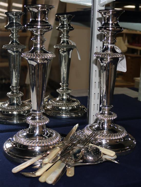 A pair of silver plated candlesticks and mixed mother of pearl cutlery etc.